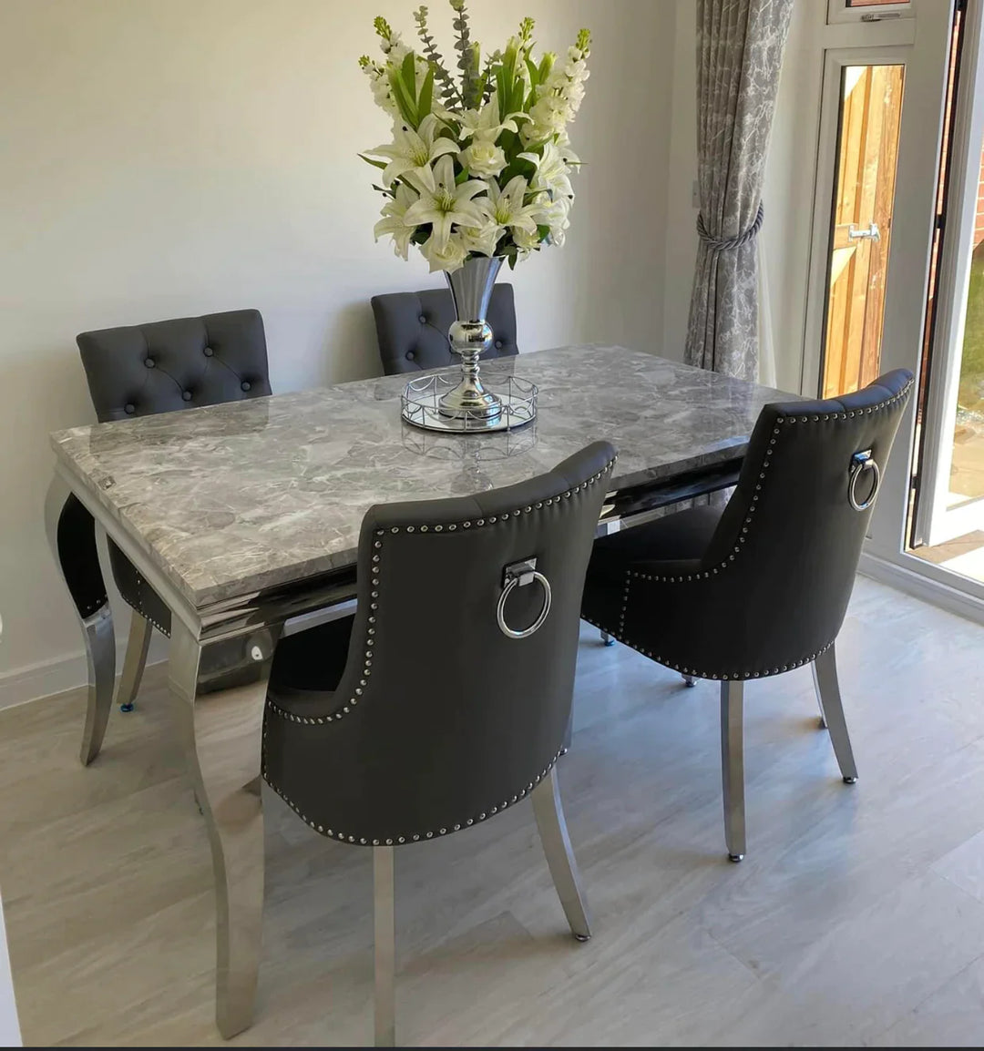 Louis Marble & Chrome Dining Table With Grey PU Leather Chrome Ring Knocker Chairs - Belmont Interiors