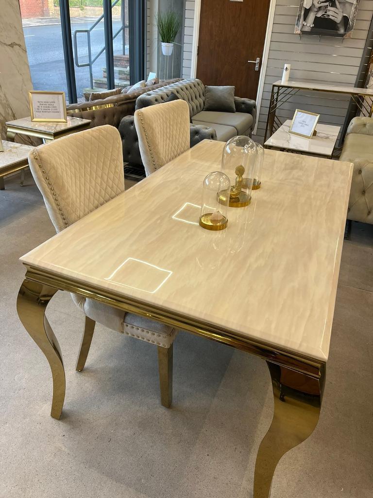 Louis Gold Cream Marble Dining Table With Shimmer Gold Lion Knocker Dining Chairs - Belmont Interiors